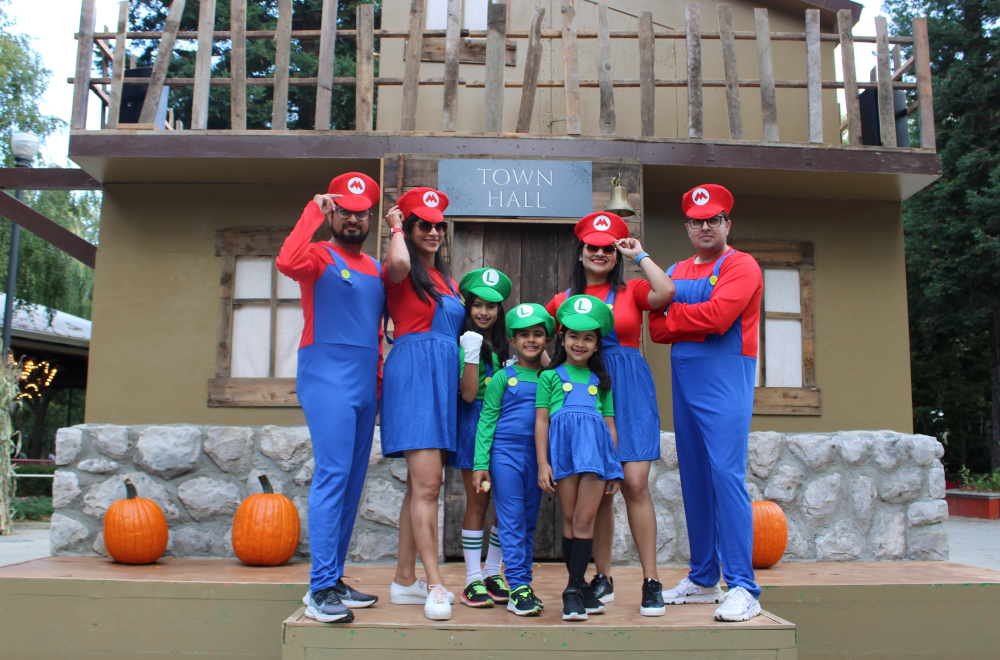 Family doing Trick-or-Treating