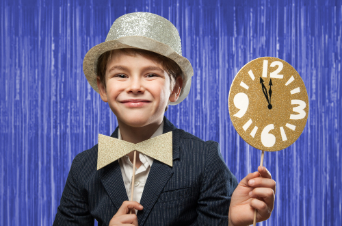 boy posing at a photo booth