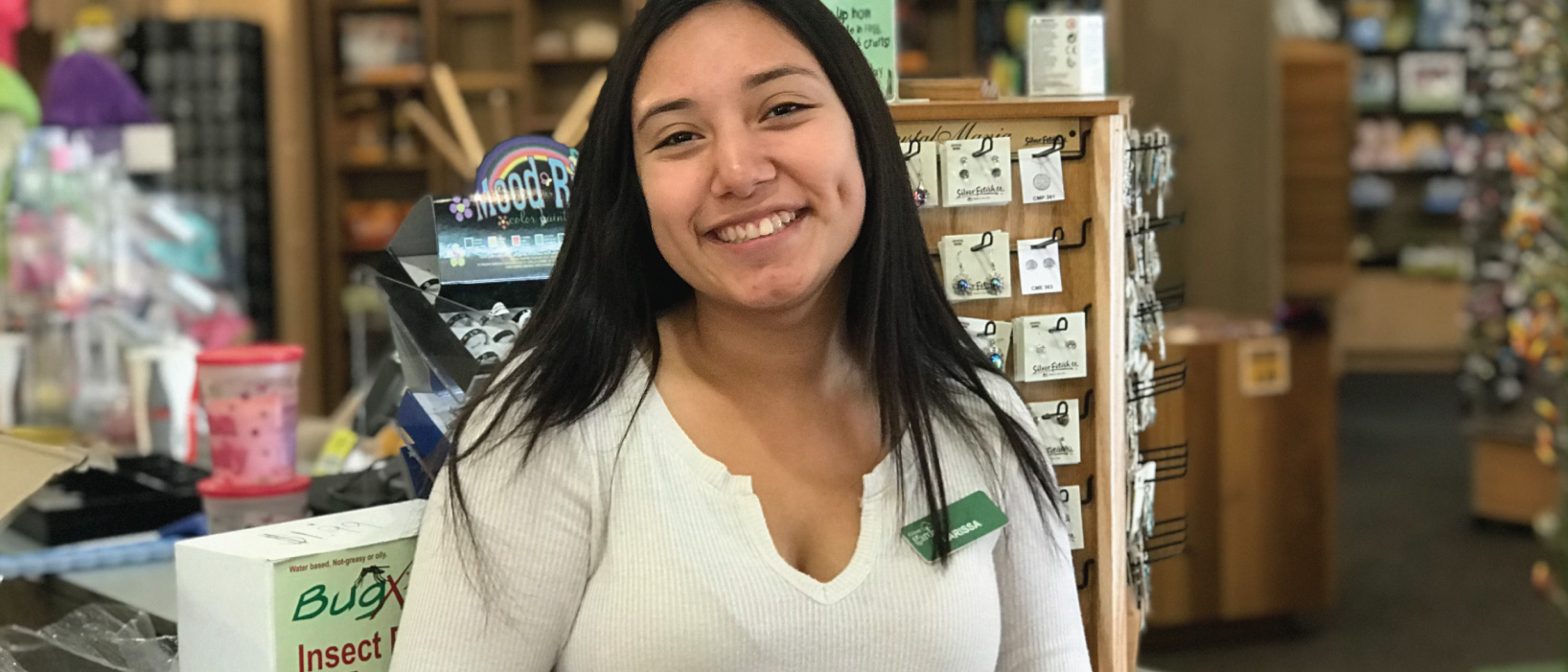 Employee smiling inside Hall’s Mercantile